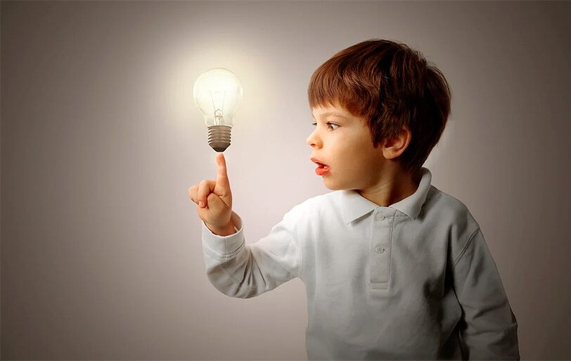 Boy with incandescent lamp